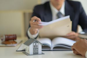 lawyer is consulting clients about the house purchase